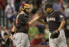 HOUSTON,TX-MAY 07 : Carlos Zambrano #38 of the Miami Marlins shakes hands with catcher John Buck #14 after striking out Jose Altuve #27 of the Houston Astros to end the game on May 7, 2012 at Minute Maid Park in Houston, Texas. Miami defeated Houston 4-0. (Photo by Bob Levey/Getty Images)