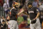 HOUSTON,TX-MAY 07 : Carlos Zambrano #38 of the Miami Marlins shakes hands with catcher John Buck #14 after striking out Jose Altuve #27 of the Houston Astros to end the game on May 7, 2012 at Minute Maid Park in Houston, Texas. Miami defeated Houston 4-0. (Photo by Bob Levey/Getty Images)