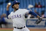 TORONTO, CANADA - MAY 1: Neftali Feliz #30 of the Texas Rangers pitches against the Toronto Blue Jays during MLB action at the Rogers Centre May 1, 2012 in Toronto, Ontario, Canada.  (Photo by Abelimages/Getty Images)