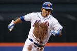 NEW YORK, NY - APRIL 23:  Ruben Tejada #11 of the New York Mets rounds third base to score a second inning run against the San Francisco Giants at Citi Field on April 23, 2012 in the Flushing neighborhood of the Queens borough of New York City.  (Photo by Jim McIsaac/Getty Images)