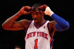 NEW YORK, NY - MAY 06:  Amare Stoudemire #1 of the New York Knicks adjusts his glasses against the Miami Heat in Game Four of the Eastern Conference Quarterfinals in the 2012 NBA Playoffs on May 6, 2012 at Madison Square Garden in New York City. NOTE TO USER: User expressly acknowledges and agrees that, by downloading and or using this photograph, User is consenting to the terms and conditions of the Getty Images License Agreement  (Photo by Jeff Zelevansky/Getty Images)