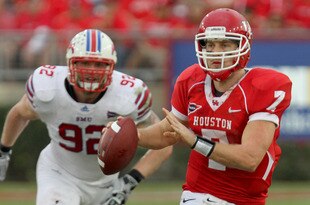 HOUSTON, TX - NOVEMBER 19: Quarterback Case Keenum #7 of the Houston Cougars rushes with the ball while defensive end Margus Hunt #92 of the Southern Methodist University Mustangs gives chase on November 19, 2011 at Robertson Stadium in Houston, Texas. (Photo by Thomas B. Shea/Getty Images)