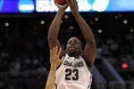PHOENIX, AZ - MARCH 22:  Draymond Green #23 of the Michigan State Spartans shoots over Peyton Siva #3 of the Louisville Cardinals during the 2012 NCAA Men's Basketball West Regional Semifinal game at US Airways Center on March 22, 2012 in Phoenix, Arizona.  (Photo by Jamie Squire/Getty Images)