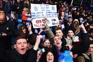LONDON, ENGLAND - MAY 06:  Queens Park Rangers fans celebrate at the end of the Barclays Premier League match between Queens Park Rangers and Stoke City at Loftus Road on May 6, 2012 in London, England.  (Photo by Julian Finney/Getty Images)