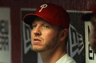 PHOENIX, AZ - APRIL 25:  Pitcher Roy Halladay #34 of the Philadelphia Phillies watches from the dugout during the MLB game against the Arizona Diamondbacks at Chase Field on April 25, 2012 in Phoenix, Arizona.  (Photo by Christian Petersen/Getty Images)