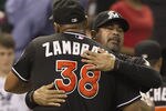 HOUSTON,TX-MAY 07 : Carlos Zambrano #38 of the Miami Marlins gets a hug from manager Ozzie Guillen after striking out Jose Altuve #27 of the Houston Astros to end the game on May 7, 2012 at Minute Maid Park in Houston, Texas. Miami defeated Houston 4-0. (Photo by Bob Levey/Getty Images)