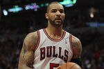 CHICAGO, IL - MAY 08:  Carlos Boozer #5 of the Chicago Bulls handles the ball during a free-throw against the Philadelphia 76ers in Game Five of the Eastern Conference Quarterfinals during the 2012 NBA Playoffs at the United Center on May 8, 2012 in Chicago, Illinois. The Bulls defeated the 76ers 77-69. NOTE TO USER: User expressly acknowledges and agrees that, by downloading and or using this photograph, User is consenting to the terms and conditions of the Getty Images License Agreement.  (Photo by Jonathan Daniel/Getty Images)