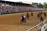 BALTIMORE, MD - MAY 21:  Jockey Jesus Castanon guides Shackleford #5 (C) to victory over Animal Kingdom and jocky John Velazquez #11 (L) and Astrology with jockey Mike Smith #1 (R) to win the 136th running of the Preakness Stakes at Pimlico Race Course on May 21, 2011 in Baltimore, Maryland.  (Photo by Rob Carr/Getty Images)