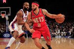 NEW YORK, NY - FEBRUARY 20: Deron Williams #8 of the New Jersey Nets dribbles past Baron Davis #85 of the New York Knicks at Madison Square Garden on February 20, 2012 in New York City. NOTE TO USER: User expressly acknowledges and agrees that, by downloading and/or using this Photograph, user is consenting to the terms and conditions of the Getty Images License Agreement.  (Photo by Chris Trotman/Getty Images)