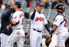 CLEVELAND, OH - MAY 7: Jack Hannahan #9 manager manager Manny Acta #11 and Carlos Santana #41 of the Cleveland Indians celebrate after defeating the Chicago White Sox at Progressive Field on May 7, 2012 during the first game of a doubleheader in Cleveland, Ohio. The Indians defeated the White Sox 8-6. (Photo by Jason Miller/Getty Images)
