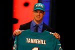 NEW YORK, NY - APRIL 26:  Ryan Tannehill from Texas A&M holds up a jersey as he stands on stage after he was selected #8 overall by the Miami Dolphins in the first round of during the 2012 NFL Draft at Radio City Music Hall on April 26, 2012 in New York City.  (Photo by Al Bello/Getty Images)