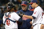 CLEVELAND, OH - MAY 9: Catcher Carlos Santana #41 pitching coach Scott Radinsky #36 and starting pitcher Jeanmar Gomez #58 of the Cleveland Indians talk during the fourth inning against the Chicago White Sox at Progressive Field on May 9, 2012 in Cleveland, Ohio. (Photo by Jason Miller/Getty Images)