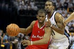 MEMPHIS, TN - APRIL 29:  Chris Paul #3 of the Los Angeles Clippers dribbles the ball while defended by Mike Conley #11 of the Memphis Grizzlies the in Game One of the Western Conference Quarterfinals in the 2012 NBA Playoffs at FedExForum on April 29, 2012 in Memphis, Tennessee.  NOTE TO USER: User expressly acknowledges and agrees that, by downloading and or using this photograph, User is consenting to the terms and conditions of the Getty Images License Agreement.  (Photo by Andy Lyons/Getty Images)