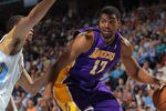 DENVER, CO - MAY 04:  Andrew Bynum #17 of the Los Angeles Lakers dribbles the ball against JaVale McGee #34 of the Denver Nuggets in Game Three of the Western Conference Quarterfinals in the 2012 NBA Playoffs at Pepsi Center on May 4, 2012 in Denver, Colorado. The Nuggets defeated the Lakers 99-84 as the Lakers hold a 2-1 advantage in the series. NOTE TO USER: User expressly acknowledges and agrees that, by downloading and or using this photograph, User is consenting to the terms and conditions of the Getty Images License Agreement.  (Photo by Doug Pensinger/Getty Images)