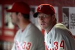PHOENIX, AZ - APRIL 26:  Pitcher Roy Halladay #34 (R) and Cliff Lee #33 of the Philadelphia Phillies sit in the dugout during the Major League Baseball game against the Arizona Diamondbacks at Chase Field on April 26, 2011 in Phoenix, Arizona.  (Photo by Christian Petersen/Getty Images)