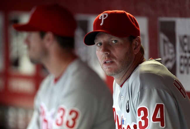 PHOENIX, AZ - APRIL 26:  Pitcher Roy Halladay #34 (R) and Cliff Lee #33 of the Philadelphia Phillies sit in the dugout during the Major League Baseball game against the Arizona Diamondbacks at Chase Field on April 26, 2011 in Phoenix, Arizona.  (Photo by Christian Petersen/Getty Images)