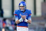 BOISE, ID - NOVEMBER 26: Kellen Moore #11 of the Boise State Broncos applauds a touchdown against the Wyoming Cowboys at Bronco Stadium on November 26, 2011 in Boise, Idaho.  (Photo by Otto Kitsinger III/Getty Images)