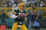 GREEN BAY, WI - DECEMBER 11:  Aaron Rodgers  #12 of the Green Bay Packers looks for a receiver against the Oakland Raiders at Lambeau Field on December 11, 2011 in Green Bay, Wisconsin. The Packers defeated the Raiders 46-16.  (Photo by Jonathan Daniel/Getty Images)
