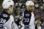 PITTSBURGH, PA - MARCH 20:  Dustin Byfuglien #33 of the Winnipeg Jets looks on against the Pittsburgh Penguins during the game at Consol Energy Center on March 20, 2012 in Pittsburgh, Pennsylvania.  (Photo by Justin K. Aller/Getty Images)