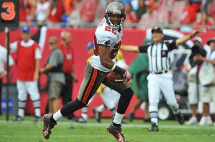 TAMPA, FL - SEPTEMBER 25:  Cornerback Ronde Barber #20 of the Tampa Bay Buccaneers recovers a first quarter fumble against the Atlanta Falcons  September 25, 2011 at Raymond James Stadium in Tampa, Florida. (Photo by Al Messerschmidt/Getty Images)