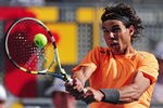 MADRID, SPAIN - MAY 10:  Rafael Nadal of Spain plays a backhand to Fernando Verdasco of Spain in the 4th round of the Mutua Madrilena Madrid Open at the Caja Magica on May 10, 2012 in Madrid, Spain.  (Photo by Mike Hewitt/Getty Images)