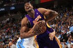 DENVER, CO - MAY 06:  Andrew Bynum #17 of the Los Angeles Lakers is wrapped up by JaVale McGee #34 of the Denver Nuggets for a jump ball in Game Four of the Western Conference Quarterfinals in the 2012 NBA Playoffs at Pepsi Center on May 6, 2012 in Denver, Colorado. NOTE TO USER: User expressly acknowledges and agrees that, by downloading and or using this photograph, User is consenting to the terms and conditions of the Getty Images License Agreement.  (Photo by Doug Pensinger/Getty Images)
