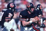 FEBRUARY 1985:  Quarterback Jim Kelly #12 of the Houston Gamblers scrambles during a 1985 season USFL game. (Photo by Stephen Dunn/Getty Images)