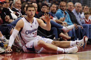 LOS ANGELES, CA - APRIL 22:  Blake Griffin #32 of the Los Angeles Clippers reacts after falling into the front row chasing a loose ball during the game against the New Orleans Hornets at Staples Center on April 22, 2012 in Los Angeles, California.  NOTE TO USER: User expressly acknowledges and agrees that, by downloading and or using this photograph, User is consenting to the terms and conditions of the Getty Images License Agreement.  (Photo by Harry How/Getty Images)