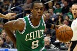 NEWARK, NJ - APRIL 14:  Rajon Rondo #9 of the Boston Celtics drives in the first half against Gerald Green #14 of the New Jersey Nets at Prudential Center on April 14, 2012 in Newark, New Jersey. NOTE TO USER: User expressly acknowledges and agrees that, by downloading and or using this photograph, User is consenting to the terms and conditions of the Getty Images License Agreement.  (Photo by Chris Chambers/Getty Images)