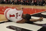 CHICAGO, IL - APRIL 28: Derrick Rose #1 of the Chicago Bulls lays on the floor aftrer suffering an injury against the Philadelphia 76ers in Game One of the Eastern Conference Quarterfinals during the 2012 NBA Playoffs at the United Center on April 28, 2012 in Chicago, Illinois. The Bulls defeated the 76ers 103-91. NOTE TO USER: User expressly acknowledges and agrees that, by downloading and or using this photograph, User is consenting to the terms and conditions of the Getty Images License Agreement. (Photo by Jonathan Daniel/Getty Images)