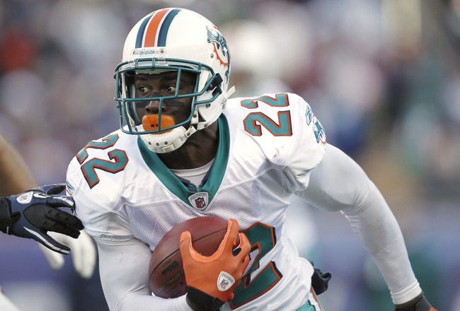 FOXBORO, MA - DECEMBER 24: Reggie Bush #22 of the Miami Dolphins  during the first quarter against the New England Patriots at Gillette Stadium on December 24, 2011 in Foxboro, Massachusetts.  (Photo by Winslow Townson/Getty Images)