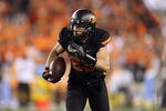 GLENDALE, AZ - JANUARY 02:  Josh Cooper #25 of the Oklahoma State Cowboys runs with the ball against the Stanford Cardinal  during the Tostitos Fiesta Bowl on January 2, 2012 at University of Phoenix Stadium in Glendale, Arizona. Oklahoma State won 41-38 in overtime. (Photo by Christian Petersen/Getty Images)