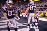 INDIANAPOLIS, IN - FEBRUARY 05:  Wes Welker #83, Rob Gronkowski #87 and Aaron Hernandez #81 of the New England Patriots wait in the end zone after losing to the New York Giants 21-17 during Super Bowl XLVI at Lucas Oil Stadium on February 5, 2012 in Indianapolis, Indiana.  (Photo by Elsa/Getty Images)