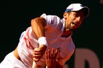 MONTE-CARLO, MONACO - APRIL 21: Novak Djokovic of Serbia serves against Tomas Berdych of Czech Republic in their semi-final during day seven of the ATP Monte Carlo Masters, at Monte-Carlo Sporting Club  on April 21, 2012 in Monte-Carlo, Monaco.  (Photo by Clive Brunskill/Getty Images)