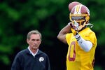 ASHBURN, VA - MAY 06:  Washington Redskins head coach Mike Shanahan watches Robert Griffin III #10 practice during the Washington Redskins rookie minicamp on May 6, 2012 in Ashburn, Virginia.  (Photo by Patrick McDermott/Getty Images)