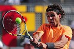 MADRID, SPAIN - MAY 10:  Rafael Nadal of Spain plays a backhand to Fernando Verdasco of Spain in the 4th round of the Mutua Madrilena Madrid Open at the Caja Magica on May 10, 2012 in Madrid, Spain.  (Photo by Mike Hewitt/Getty Images)
