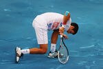 MADRID, SPAIN - MAY 11:  Novak Djokovic of Serbia struggles on the blue clay during his quarter final defeat to fellow countryman Janko Tipsarevic during Day Seven of the Mutua Madrilena Madrid Open at the Caja Magica on May 11, 2012 in Madrid, Spain.  (Photo by Mike Hewitt/Getty Images)