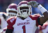 OXFORD,  MS - OCTOBER 22:   Marquel Wade #1 of the Arkansas Razorbacks salutes the crowd after a big run against the Ole Miss Rebels at Vaught-Hemingway Stadium on October 22, 2011 in Oxford, Mississippi.  The Razorbacks defeated the Rebels 29 to 24.  (Photo by Wesley Hitt/Getty Images)