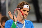 MADRID, SPAIN - MAY 09:  Roger Federer of Switzerland celebrates victory after his 3rd round win over Milos Raonic of Canada in the Mutua Madrilena Madrid Open at the Caja Magica on May 9, 2012 in Madrid, Spain.  (Photo by Mike Hewitt/Getty Images)
