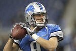 DETROIT - NOVEMBER 20:  Matthew Stafford #9 of the Detroit Lions warms up on the sides lines during the game against the Carolina Panthers at Ford Field on November 20, 2011 in Detroit, Michigan. The Lions defeated the Panthers 49-35.  (Photo by Leon Halip/Getty Images)