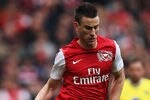 LONDON, ENGLAND - MAY 05:  Laurent Koscielny of Arsenal is tackled by Simeon Jackson of Norwich City during the Barclays Premier League match between Arsenal and Norwich City at the Emirates Stadium on May 5, 2012 in London, England.  (Photo by Bryn Lennon/Getty Images)