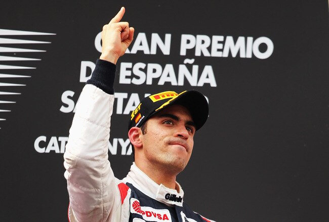 BARCELONA, SPAIN - MAY 13:  Pastor Maldonado of Venezuela and Williams celebrates on the podium after winning the Spanish Formula One Grand Prix at the Circuit de Catalunya on May 13, 2012 in Barcelona, Spain.  (Photo by Mark Thompson/Getty Images)