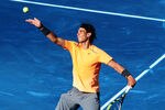 MADRID, SPAIN - MAY 10:  Rafael Nadal of Spain serves the ball to his fellow countryman Fernando Verdasco during the Mutua Madrilena Madrid Open tennis tournament at the Caja Magica on May 10, 2012 in Madrid, Spain.  (Photo by Jasper Juinen/Getty Images)