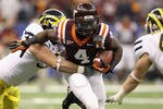 NEW ORLEANS, LA - JANUARY 03:  David Wilson #4 of the Virginia Tech Hokies runs the ball against the Michigan Wolverines during the Allstate Sugar Bowl at Mercedes-Benz Superdome on January 3, 2012 in New Orleans, Louisiana.  (Photo by Matthew Stockman/Getty Images)