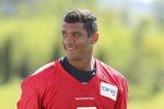 RENTON, WA - MAY 11:  Quarterback Russell Wilson #3 of the Seattle Seahawks smiles as he leaves the field after minicamp at the Virginia Mason Athletic Center on May 11, 2012 in Renton, Washington. (Photo by Otto Greule Jr/Getty Images)