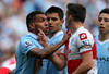 MANCHESTER, ENGLAND - MAY 13:  Carlos Tevez of Manchester City clashes with Joey Barton of QPR after being fouled during the Barclays Premier League match between Manchester City and Queens Park Rangers at the Etihad Stadium on May 13, 2012 in Manchester, England.  (Photo by Alex Livesey/Getty Images)