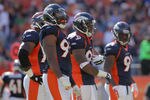 DENVER, CO - SEPTEMBER 18:  (L-R) Denver Broncos defensive linemen Brodrick Bunkley #77, Jason Hunter #90, Kevin Vickerson #99, and  Robert Ayers #91 of the Denver Broncos prepare to defend the Cincinnati Bengals  at Sports Authority Field at Mile High on September 18, 2011 in Denver, Colorado. The Broncos defeated the Bengals 24-22.  (Photo by Doug Pensinger/Getty Images)