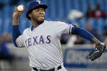 TORONTO, CANADA - MAY 1: Neftali Feliz #30 of the Texas Rangers pitches against the Toronto Blue Jays during MLB action at the Rogers Centre May 1, 2012 in Toronto, Ontario, Canada.  (Photo by Abelimages/Getty Images)