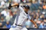 NEW YORK, NY - MAY 13:  Andy Pettitte #46 of the New York Yankees throws a first inning pitch against the Seattle Mariners at Yankee Stadium on May 13, 2012  in the Bronx borough of New York City.  (Photo by Jim McIsaac/Getty Images)