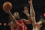 CHICAGO, IL - APRIL 02:  Marcus Camby #29 of the Houston Rockets shoots against Omer Asik #3 of the Chicago Bulls at the United Center on April 2, 2012 in Chicago, Illinois. The Rockets defeated the Bulls 99-93. NOTE TO USER: User expressly acknowledges and agrees that, by downloading and or using this photograph, User is consenting to the terms and conditions of the Getty Images License Agreement.  (Photo by Jonathan Daniel/Getty Images)